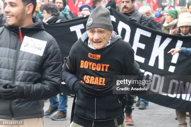 People, carrying banners and Palestinian flags gather to stage solidarity demonstration with Palestinians and protest against the Israeli attacks on...