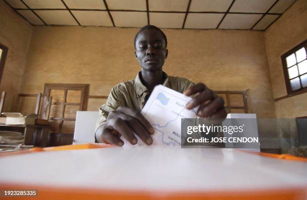 Man casts his vote at a polling station in Bukavu, 18 December 2005. Polls opened early Sunday in the Democratic Republic of Congo , with voters set...