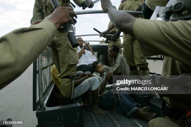 Young supporter of the opposition CUF is arrested by anti-riot police 31 October 2005 in the Darajani district of Stone Town, Zanzibar. The army used...