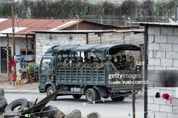 Ecuadorean Army members patrol around the perimeter of the Zonal 8 penitentiary complex facilities following the escape of several prisoners earlier...