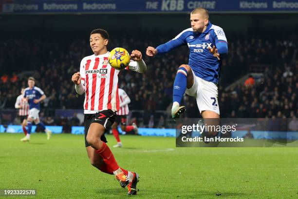 Harry Clarke of Ipswich clears the ball ahead of Jobe Bellingham of Sunderland during the Sky Bet Championship match between Ipswich Town and...