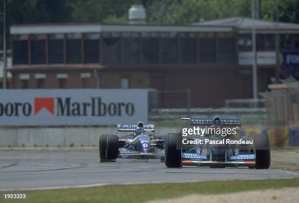 Benetton Ford driver Michael Schumacher of Germany leads from Williams Renault driver Damon Hill of Great Britain during the Australian Grand Prix at...
