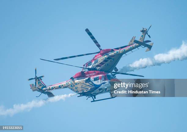 Indian Air force Surya Kiran aerobatics team, Sarang helicopter team and Sukhoi aircraft perform at Marine Drive as several people witness the Mumbai...