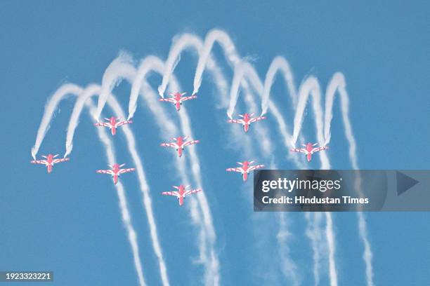 Indian Air force Surya Kiran aerobatics team, Sarang helicopter team and Sukhoi aircraft perform at Marine Drive as several people witness the Mumbai...