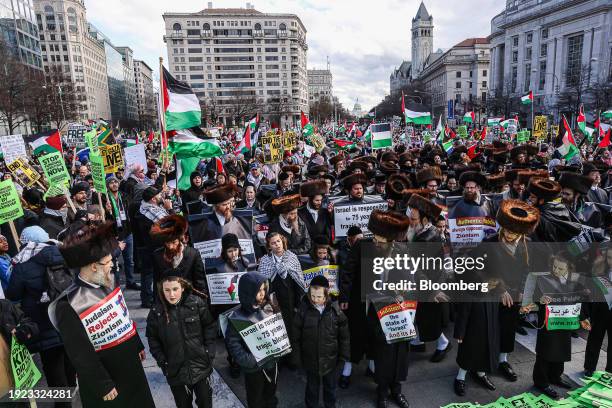 Pro-Palestinian demonstrators, including members of Neturei Karta, an international anti-Zionist and ultra-Orthodox Haredi Jewish group, during the...