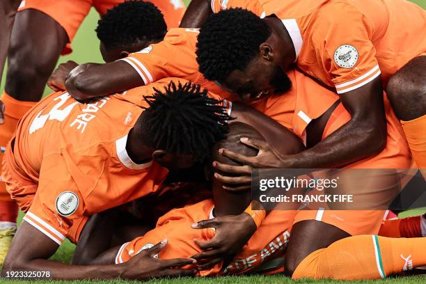 Ivory Coast's midfielder Seko Fofana celebrates scoring his team's first goal during the Africa Cup of Nations 2024 group A football match between...