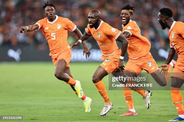 Ivory Coast's midfielder Seko Fofana celebrates scoring his team's first goal during the Africa Cup of Nations 2024 group A football match between...