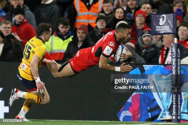 Toulouse's French wing Matthis Lebel dives over the line to score a try during the European Rugby Champions Cup pool 2 rugby union match between...