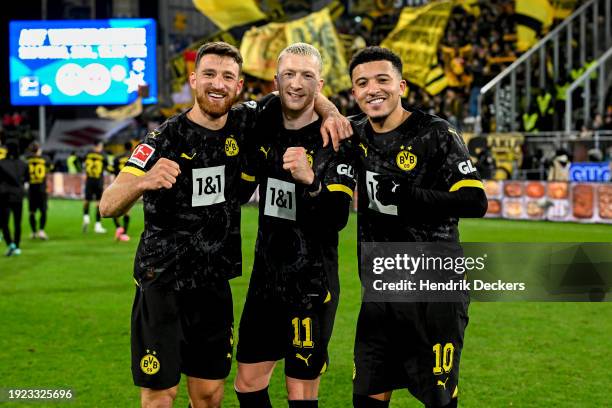 Salih Oezcan of Borussia Dortmund, Marco Reus of Borussia Dortmund and Jaden Sancho of Borussia Dortmund pose after winning the Bundesliga soccer...