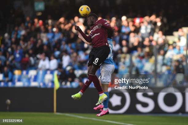Junior Sambia of US Salernitana competes for the ball with Mario Rui of SSC Napoli during the Serie A TIM match between SSC Napoli and US Salernitana...