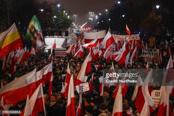 People supporting right-wing opposition Law and Justice party attend 'Free Poles Protest' in Warsaw, Poland on January 11, 2024. The previous...