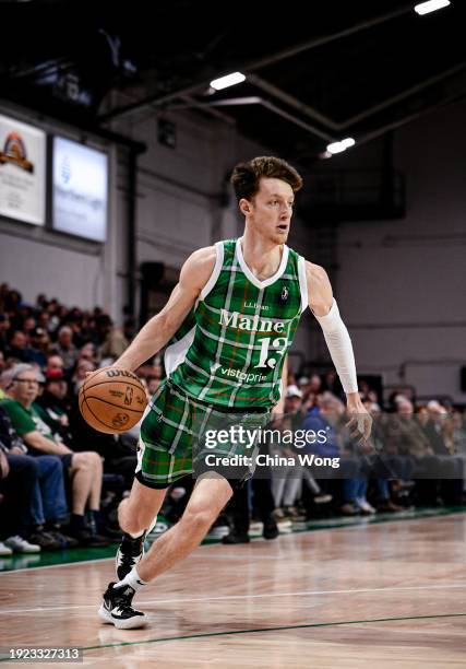 Drew Peterson of the Maine Celtics dribbles the ball during the game against the Indiana Mad Ants on January 13, 2024 at Portland Expo Center in...