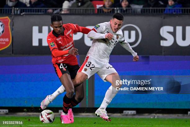 Rennes' French defender Jeremy Jacquet fights for the ball with Nice's French midfielder Tom Alexis Louchet during the French L1 football match...