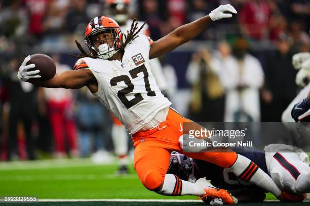 Kareem Hunt of the Cleveland Browns rushes for a touchdown against the Houston Texans during the first half of the AFC Wild Card playoff game at NRG...