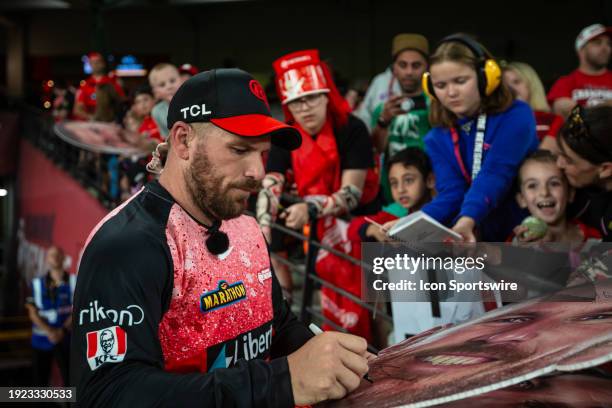 Melbourne Renegades player Aaron Finch signing autograph before the start of KFC Big Bash League T20 match between Melbourne Renegades and Melbourne...