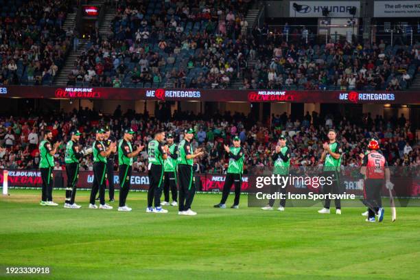 Melbourne Stars players giving standing ovation while Melbourne Renegades player Aaron Finch goes t bat for the final time for Melbourne Renegades...