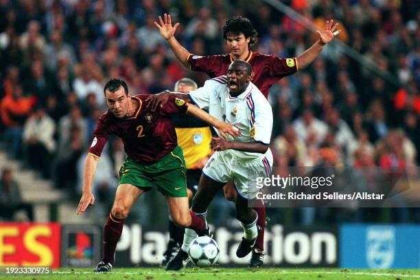 June 28: Patrick Vieira of France and Jorge Costa of Portugal challenge with Fernando Couto of Portugal behind during the UEFA Euro 2000 Semi Final...