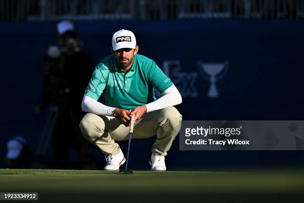 Matthieu Pavon of France waits to putt on the 18th green during the third round of Sony Open in Hawaii at Waialae Country Club on January 13, 2024 in...