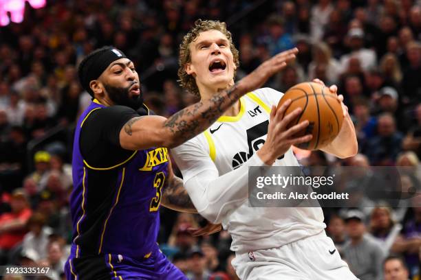 Anthony Davis of the Los Angeles Lakers defends Lauri Markkanen of the Utah Jazz during the first half of a game at Delta Center on January 13, 2024...