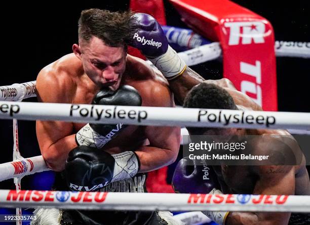 Christian Mbilli of Canada punches Rohan Murdock of Australia during their WBC Continental and WBA Intercontinental super-middleweight championship...