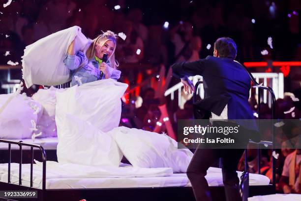 Swiss singer Beatrice Egli and German singer and presenter Florian Silbereisen perform during the Schlagerchampions "Das Groe Fest Der Besten" at...