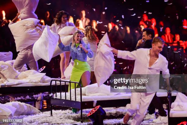 Swiss singer Beatrice Egli and German singer and presenter Florian Silbereisen perform during the Schlagerchampions "Das Groe Fest Der Besten" at...