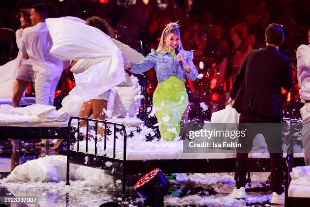 Swiss singer Beatrice Egli and German singer and presenter Florian Silbereisen perform during the Schlagerchampions "Das Groe Fest Der Besten" at...