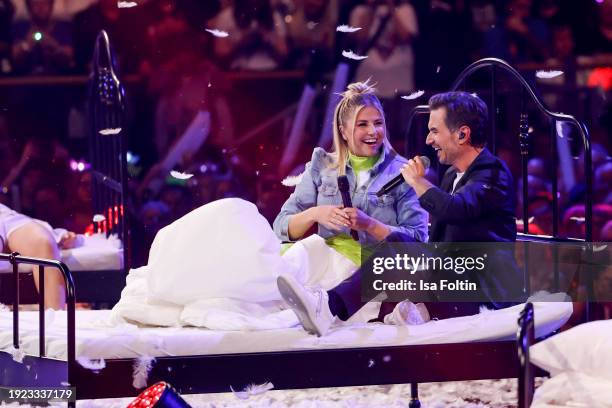 Swiss singer Beatrice Egli and German singer and presenter Florian Silbereisen perform during the Schlagerchampions "Das Groe Fest Der Besten" at...