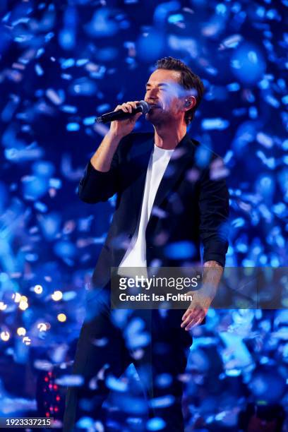 German singer and presenter Florian Silbereisen performs during the Schlagerchampions "Das Groe Fest Der Besten" at Velodrom on January 13, 2024 in...