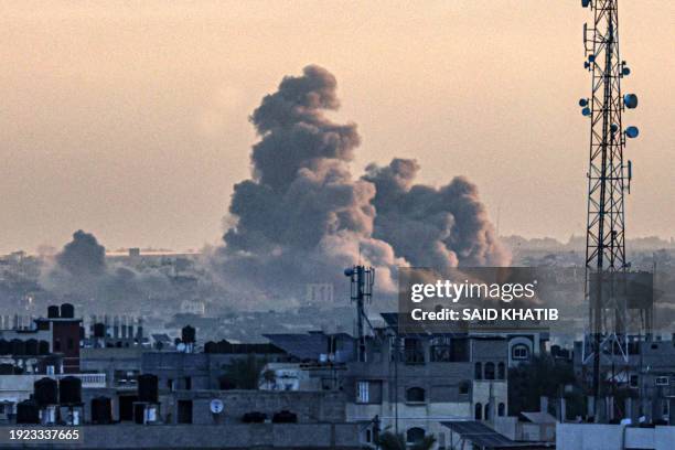 Picture taken from Rafah shows smoke billowing over Khan Yunis in the southern Gaza Strip during Israeli bombardment, as the war between Israel and...