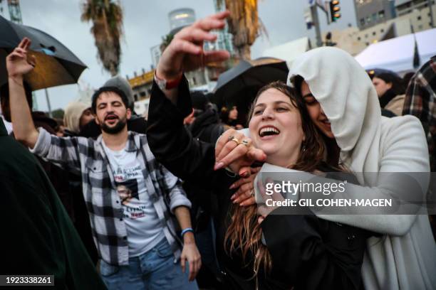 People in Tel Aviv dance at dawn to electronic music played by Artifex, the last DJ to perform at the open-air Tribe of Nova festival in the Negev...