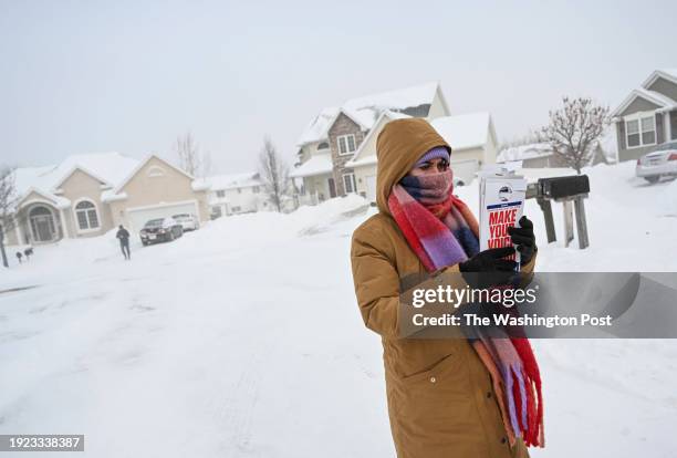 Action member Carly McCain walks away from a house while going through a neighborhood to canvas as he and his group try to drum up support for...