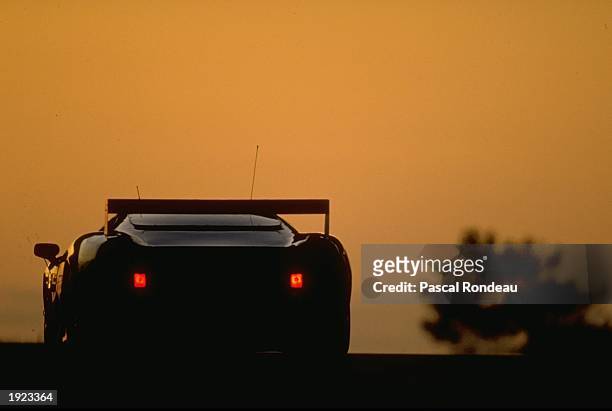 Rear view of a car at dusk during the Le Mans 24 hour race in Le Mans, France. \ Mandatory Credit: Pascal Rondeau/Allsport
