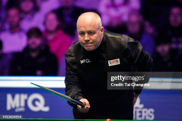 John Higgins of Scotland reacts in the first round match against Mark Allen of Northern Ireland on day 4 of the 2024 MrQ Masters Snooker at Alexandra...