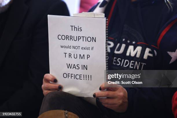 Guest holds a sign in support of Republican presidential candidate former President Donald Trump during a rally with guest speaker Republican...