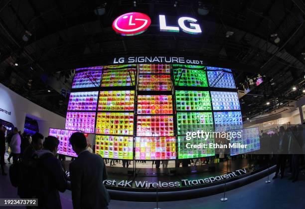 Signature OLED T televisions, the world’s first 4K wireless transparent OLED TV, are displayed at the LG Electronics booth during CES 2024 at the Las...