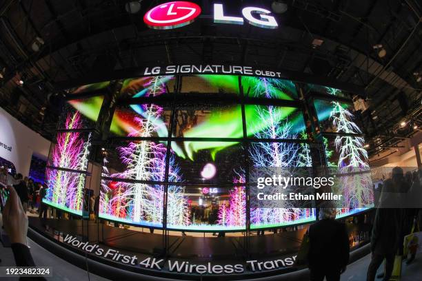 Signature OLED T televisions, the world’s first 4K wireless transparent OLED TV, are displayed at the LG Electronics booth during CES 2024 at the Las...
