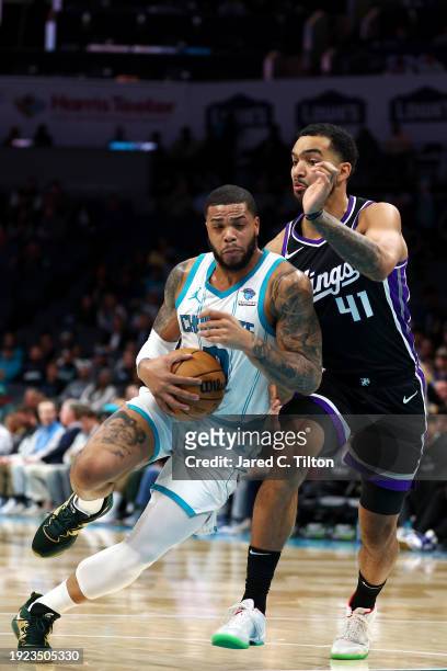 Miles Bridges of the Charlotte Hornets drives to the basket against Trey Lyles of the Sacramento Kings during the first quarter of the game at...