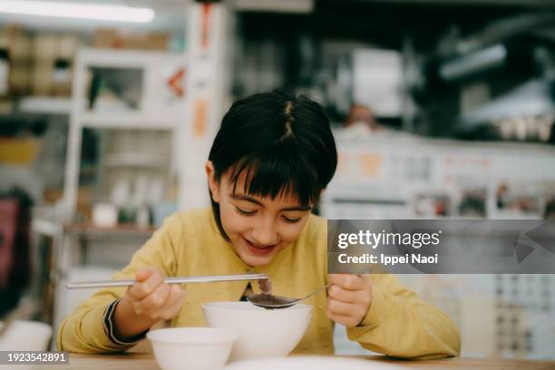 young girl enjoying street food in taiwan - tainan stock pictures, royalty-free photos & images