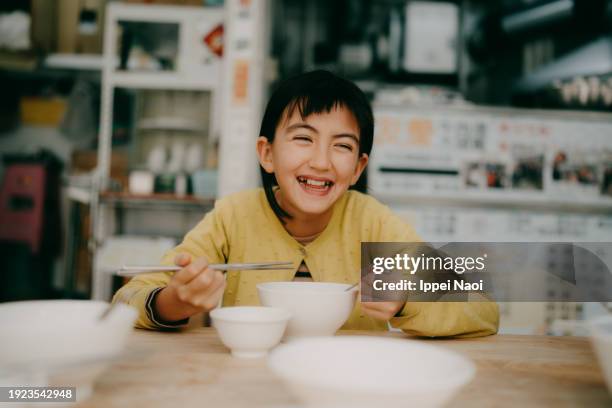 young girl enjoying street food in taiwan - tainan stock pictures, royalty-free photos & images