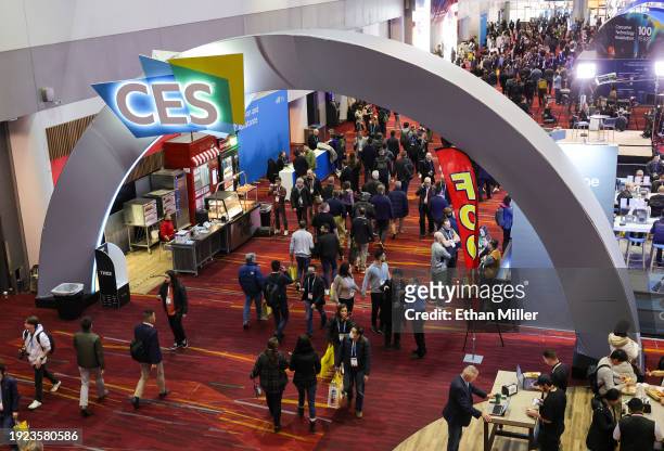 Attendees walk under a CES sign during CES 2024 at the Las Vegas Convention Center on January 10, 2024 in Las Vegas, Nevada. CES, the world's largest...