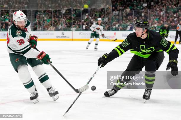 Ryan Hartman of the Minnesota Wild shoots against Thomas Harley of the Dallas Stars during the second period at American Airlines Center on January...