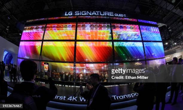 Signature OLED T televisions, the world’s first 4K wireless transparent OLED TV, are displayed at the LG Electronics booth during CES 2024 at the Las...