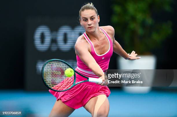 Marta Kostyuk of Ukraine plays a forehand in her match against Jelena Ostapenko of Latvia during day four of the 2024 Adelaide International at...