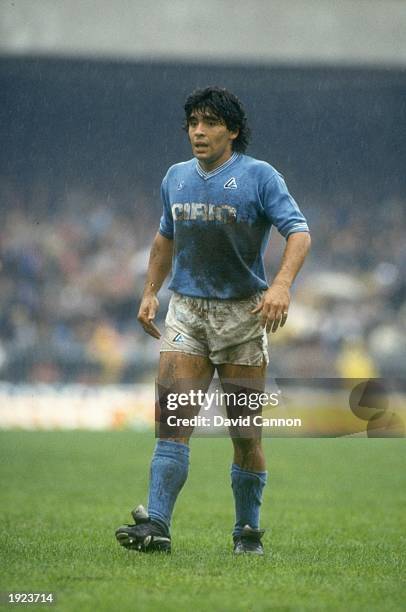 Diego Maradona of Napoli SSC rests during an Italian League match against AC Milan at the San Paolo Stadium in Naples, Italy. The match ended in a...
