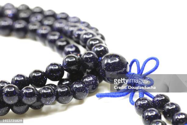 loop of buddhism prayer beads - festival wristband stock pictures, royalty-free photos & images