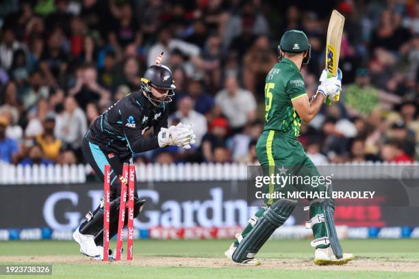 Pakistan's Aamer Jamal is stumped by New Zealand's wicketkeeper Devon Conway during the second Twenty20 international cricket match between New...