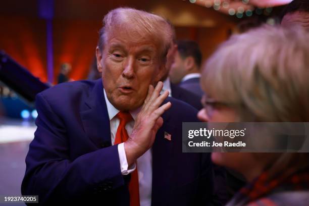 Republican presidential candidate former President Donald Trump greets guests following a Fox News Town Hall on January 10, 2024 in Des Moines, Iowa....