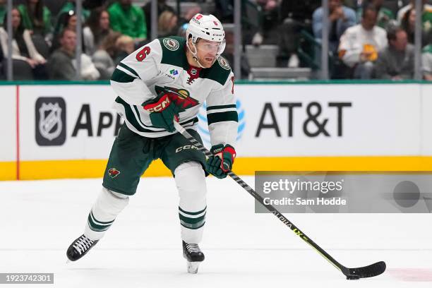 Dakota Mermis of the Minnesota Wild skates the puck during the second period against the Dallas Stars at American Airlines Center on January 10, 2024...