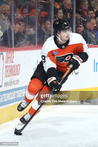 Jamie Drysdale of the Philadelphia Flyers skates with the puck during the third period against the Montreal Canadiens at the Wells Fargo Center on...